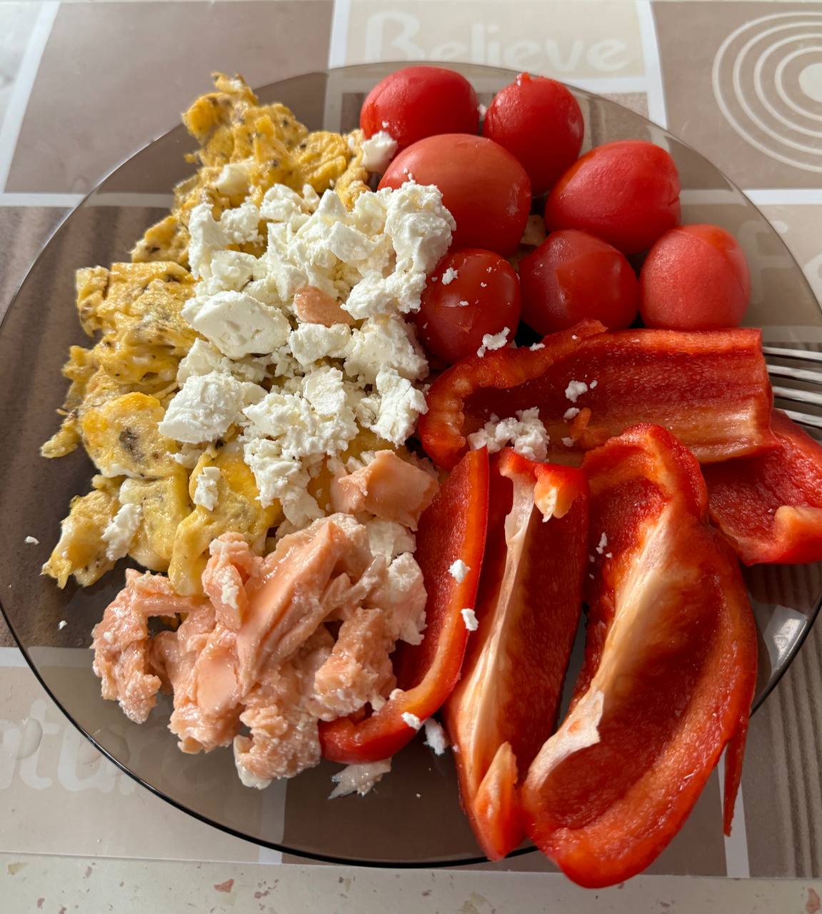 Balanced Meal With Scrambled Eggs, Smoked Salmon, Red Bell Pepper, Cherry Tomatoes, And Feta Cheese