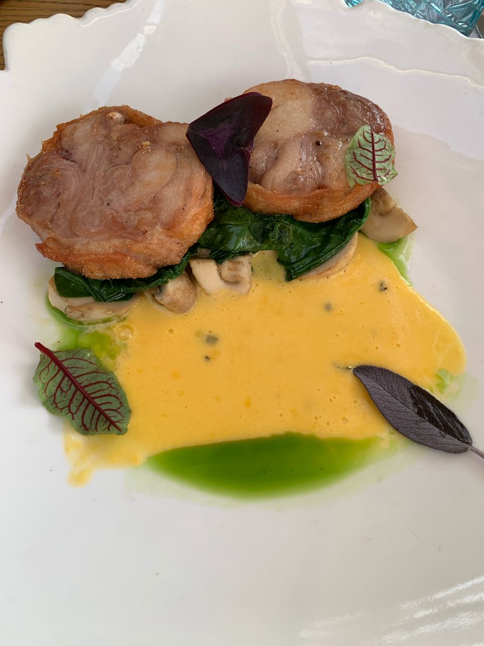 Pork dish with spinach and mushrooms