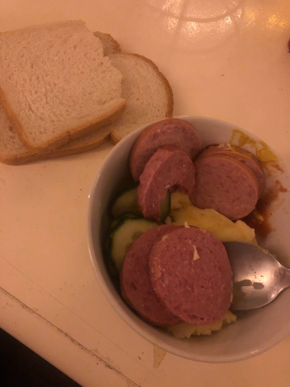 Sausage With Mashed Potatoes And Sliced Pickles