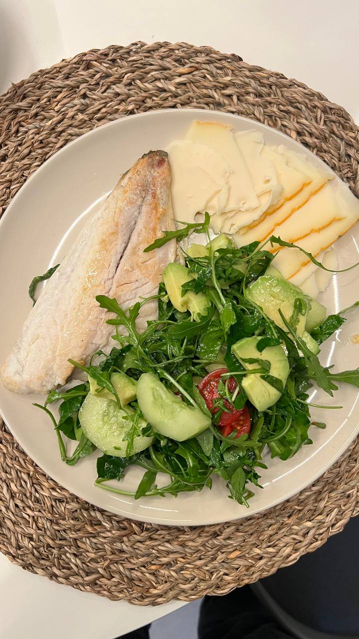 Balanced plate with fish, salad, and cheese slices