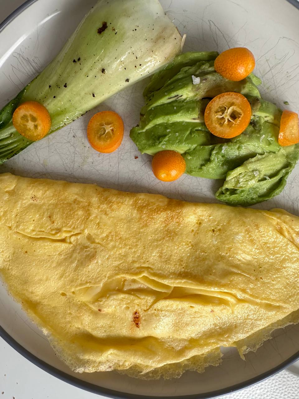 Omelette With Avocado, Kumquats, And Grilled Vegetable