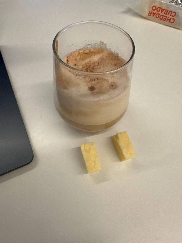 Cappuccino With Oat Milk And Two Pieces Of Cheddar Cheese