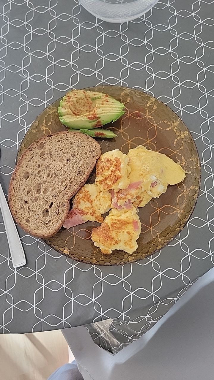 Scrambled Eggs With Ham, Whole Grain Bread, And Seasoned Avocado