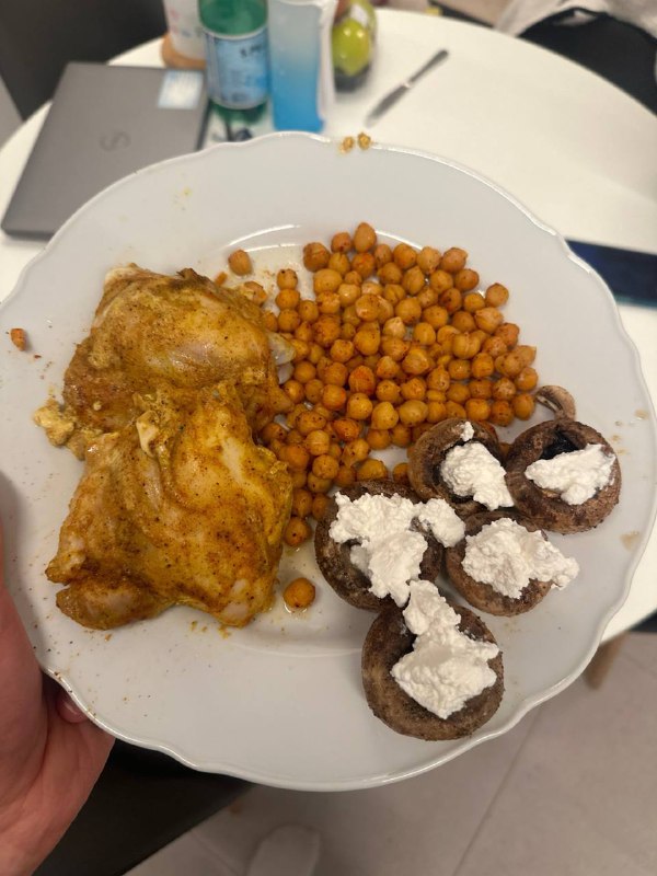 Homemade Meal With Seasoned Chicken, Roasted Chickpeas, And Stuffed Mushrooms With Cheese Topping