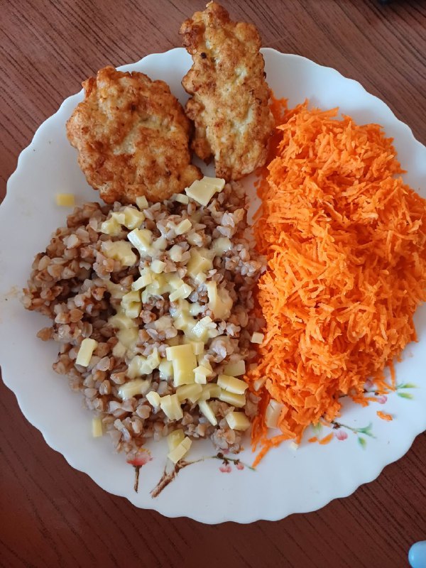 Buckwheat With Cheese, Grated Carrot Salad, And Fried Chicken Patties