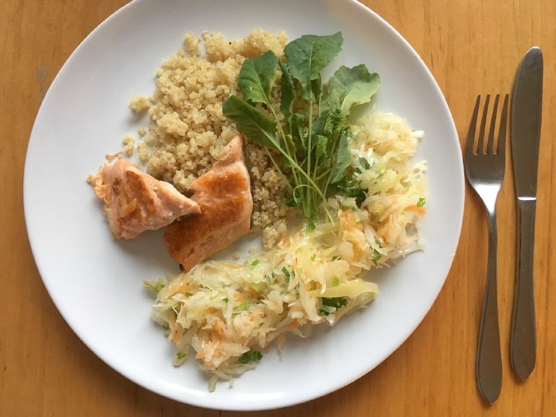 Grilled Salmon With Quinoa, Sauerkraut, And Herb Garnish