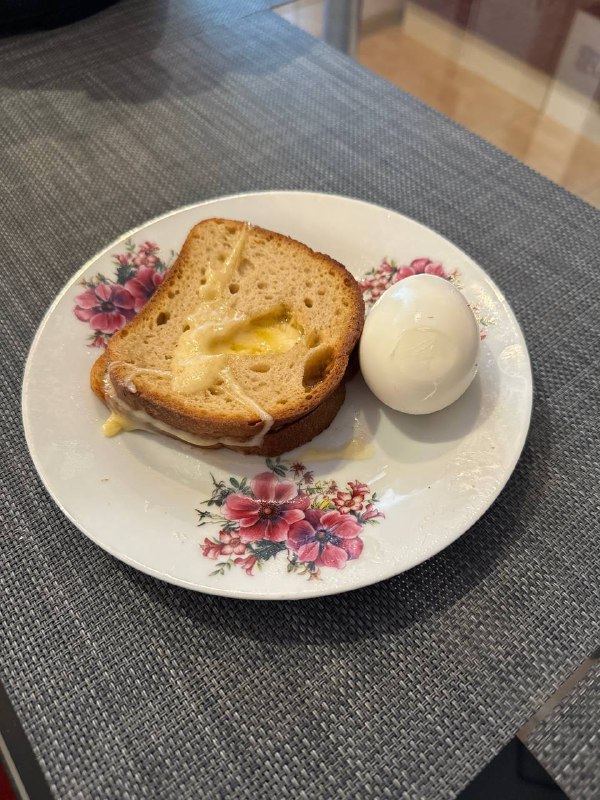 Toast with melted cheese and boiled egg