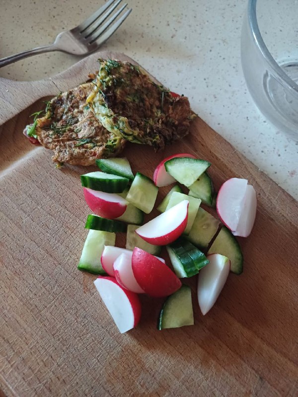 Herb Omelette With A Side Of Cucumber And Radish Salad.