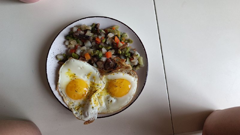 Classic Breakfast Plate: Fried Eggs And Mixed Vegetable Hash