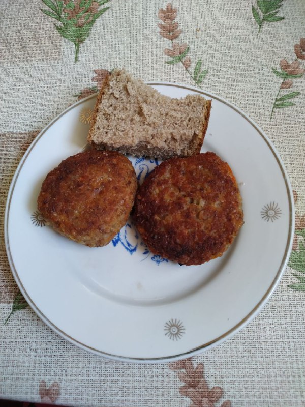 Fried Meat Patties With A Slice Of Whole-grain Bread