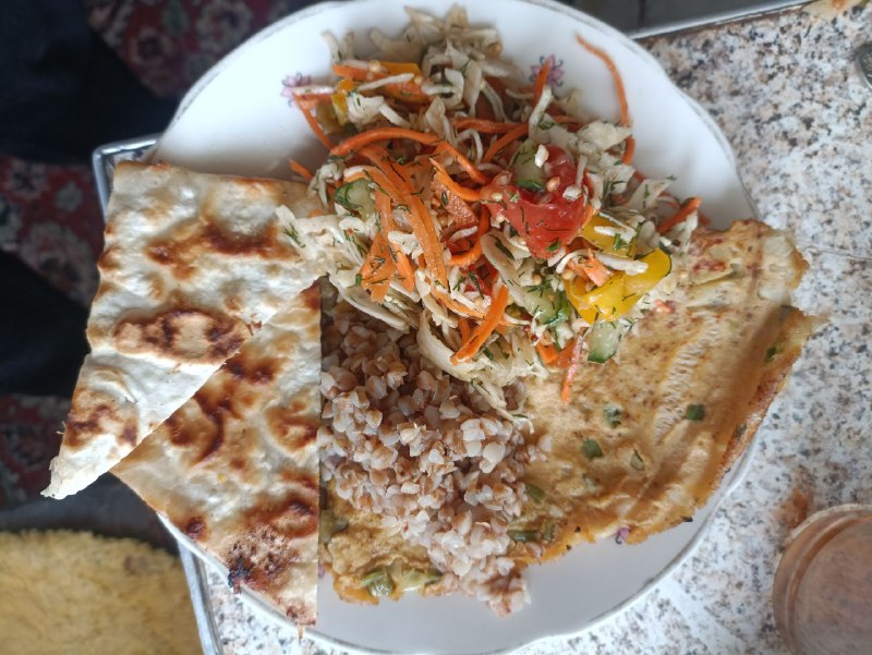 Vegetarian Meal With Omelette With Spring Onions, Buckwheat, Salad With Carrots, Cabbage, Tomato, Cucumber, Pepper, Salad Dressing, And Flatbread With Chicken