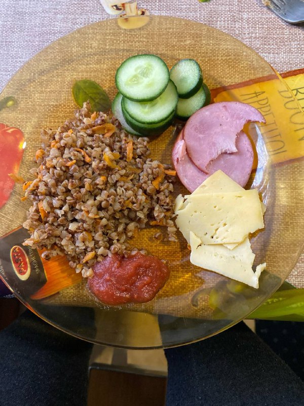 Mixture Of Buckwheat, Sliced Cucumbers, Sausage, Cheese, Tomato Sauce