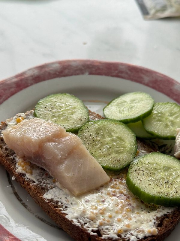 Open-faced Sandwich With Cream Cheese, Mustard Seeds, Herring, And Cucumber