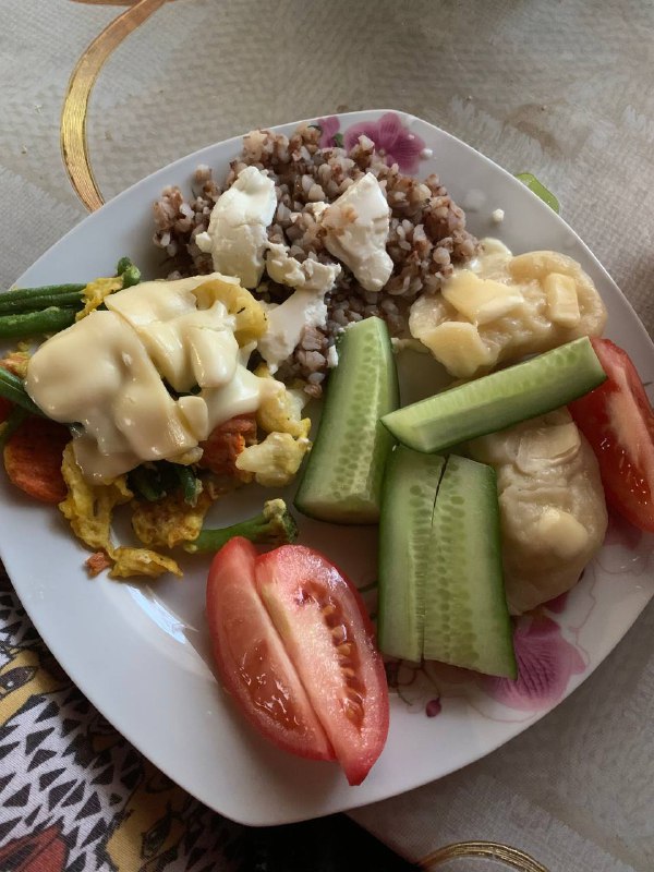 Mixed Plate With Grain, Vegetable Omelette, Cooked And Fresh Vegetables, And Cheese