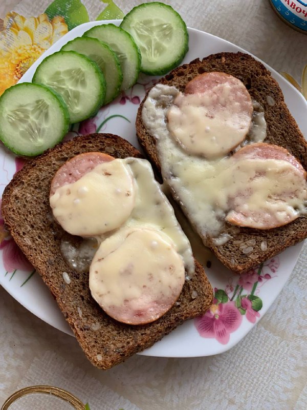 Open-faced Melted Cheese And Sausage Sandwich