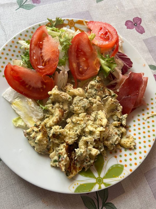 Scrambled Eggs With Herbs And A Side Salad With Prosciutto