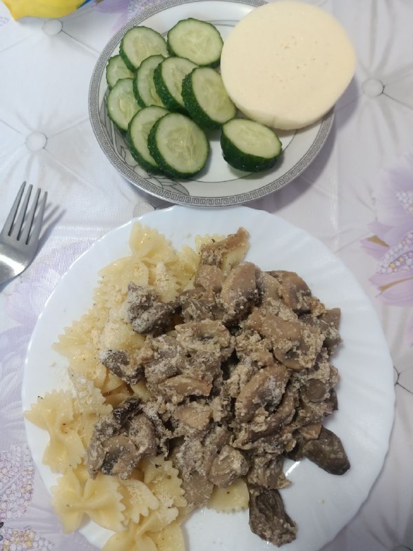 Beef Stroganoff With Pasta And A Side Of Cucumber Salad With Cheese