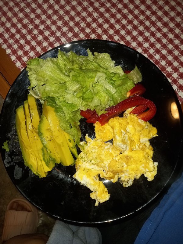 Mixed Plate With Scrambled Egg, Avocado, Lettuce Salad, And Red Bell Pepper