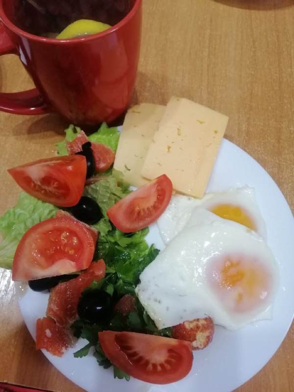 Breakfast Plate With Eggs, Cheese, Vegetables, And Red Fish Trout