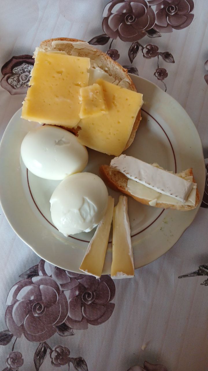 Boiled Eggs With Cheese Slices And Bread