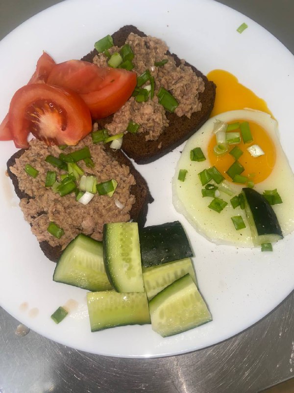 Tuna Salad On Whole-grain Bread With A Side Of Fried Eggs, Cucumber, And Tomato