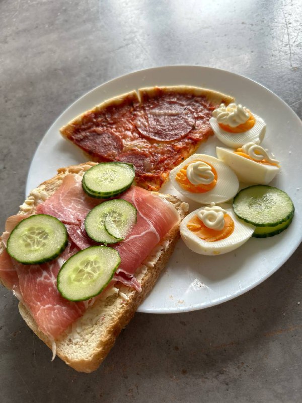 Assortment Of Open-faced Sandwiches With Various Toppings And A Slice Of Pizza