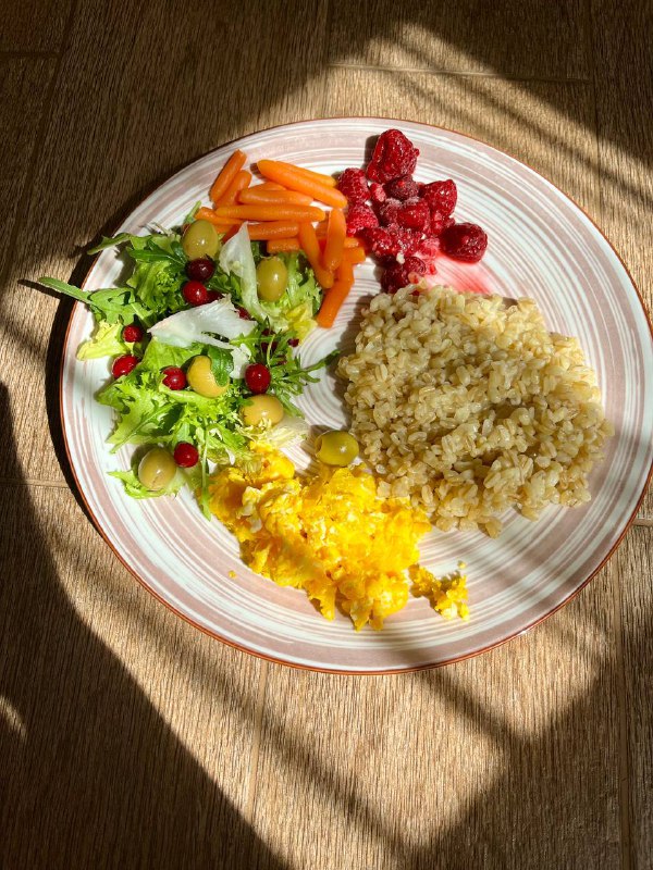 Mixed Plate With Bulgur, Scrambled Eggs, Salad, And Dried Cranberries