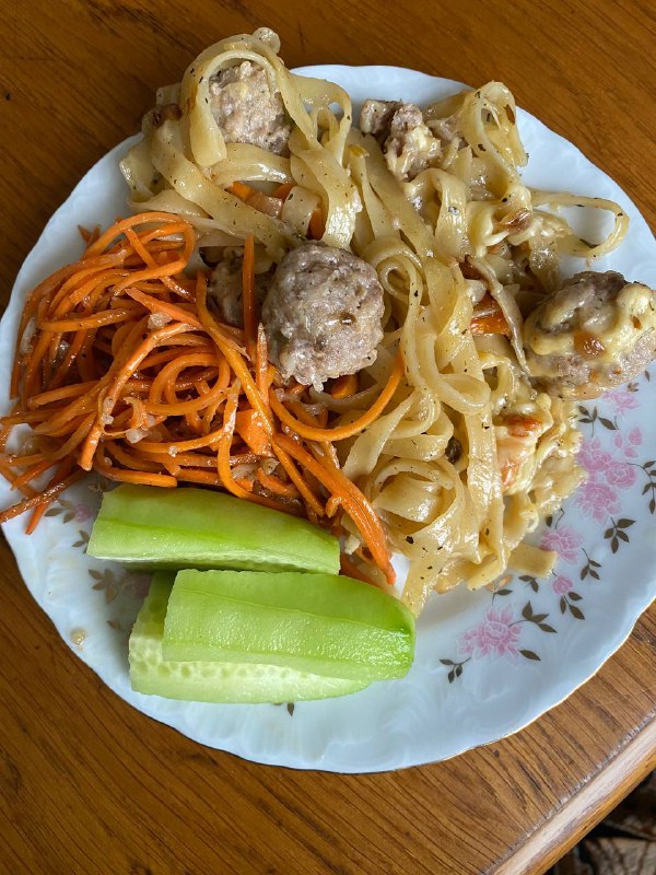 Pasta With Meatballs, Carrot Salad, And Cucumber Slices