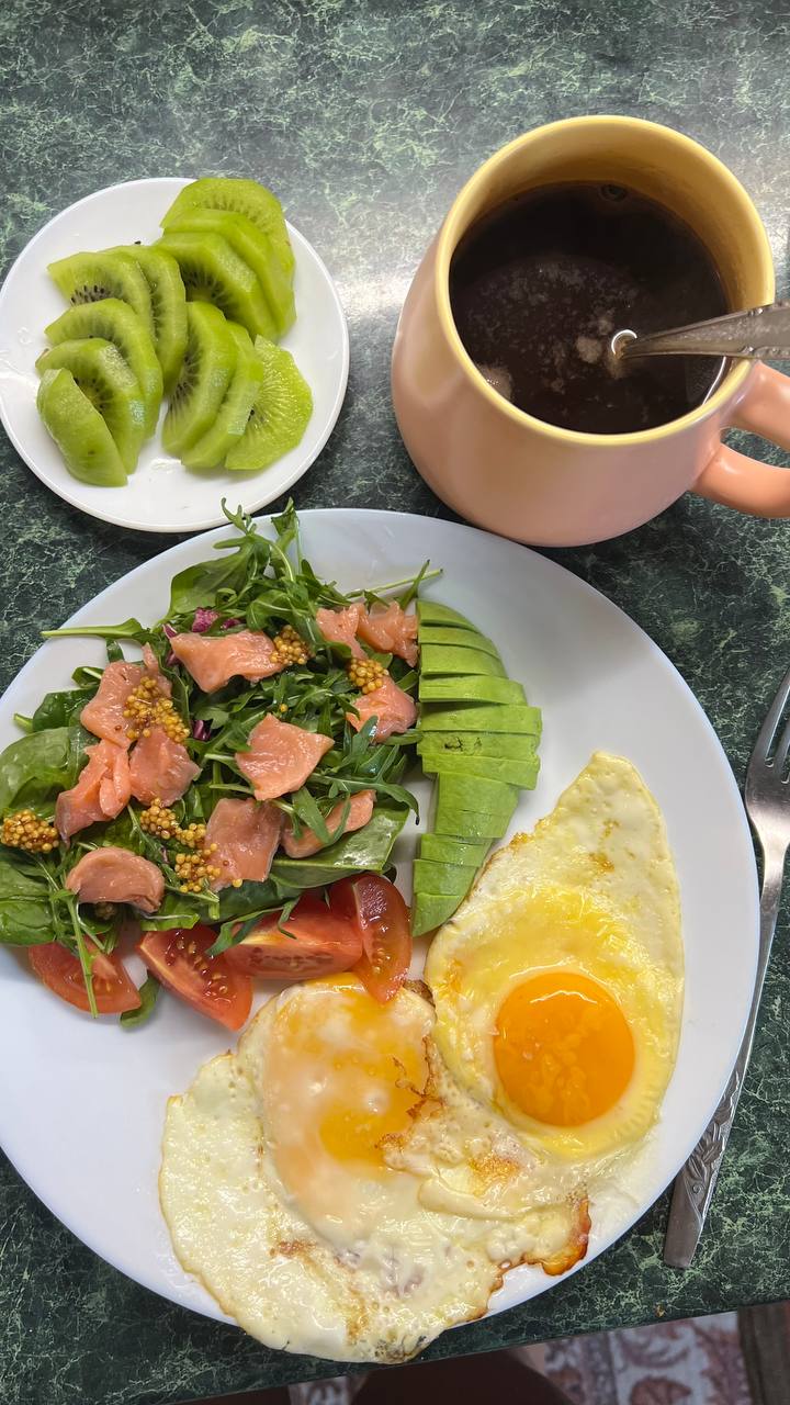 Breakfast Plate With Eggs, Smoked Salmon Salad, Avocado, And Kiwi