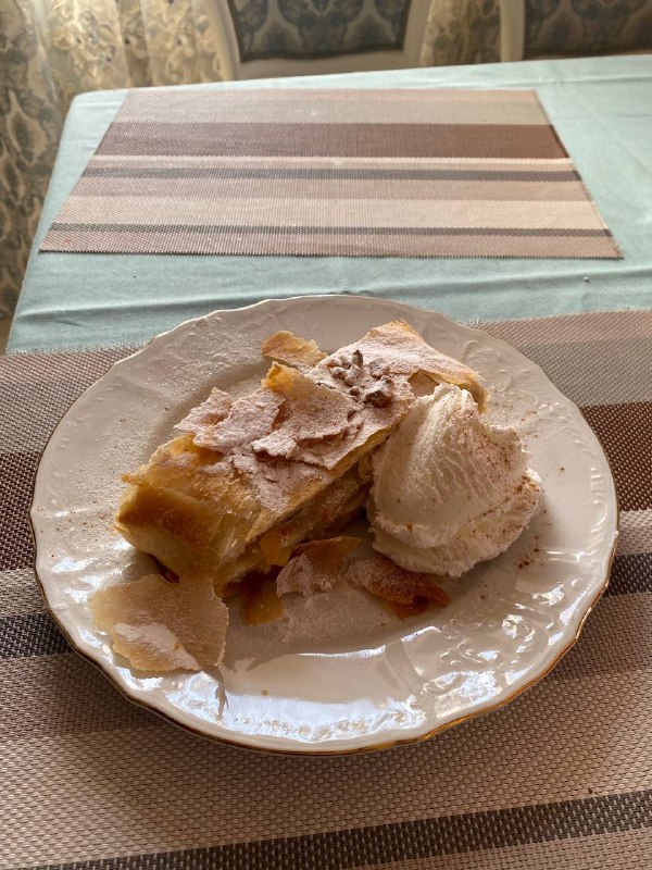 Apple pie with a scoop of vanilla ice cream