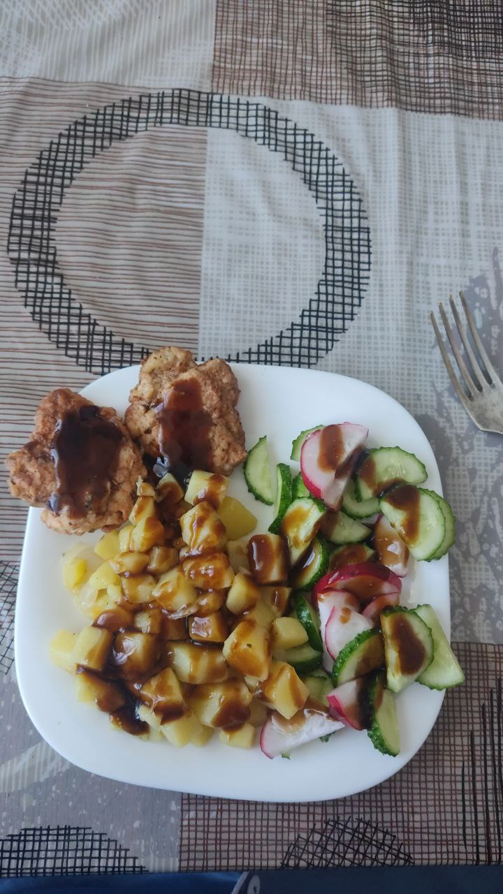 Breaded Chicken Patties With Potatoes And Cucumber Radish Salad