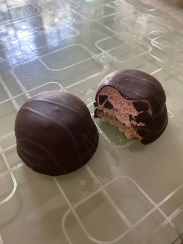 Chocolate-covered Cream-filled Cake Or Dome-shaped Sweet Pastry