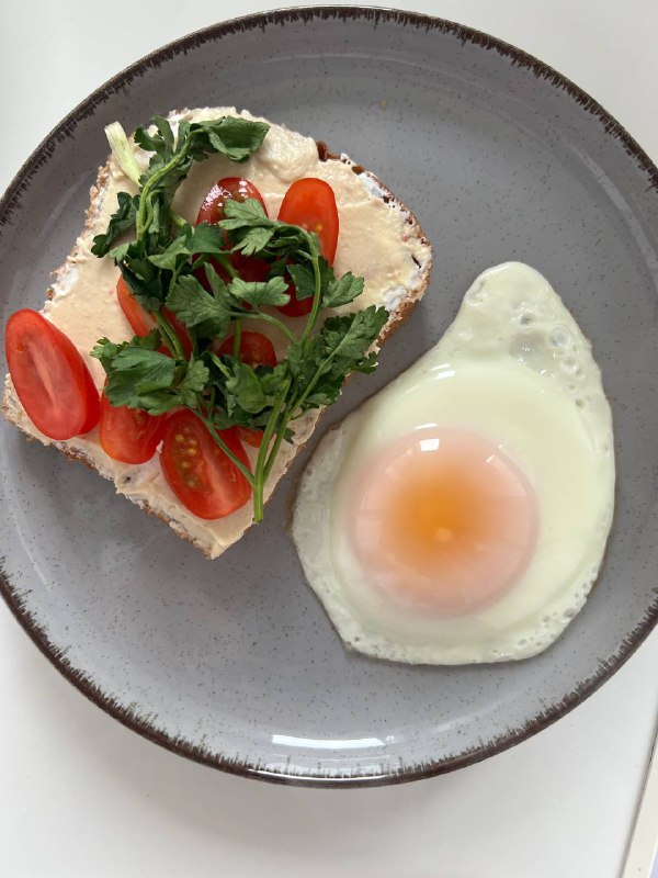 Open-faced Tomato And Herb Sandwich With Fried Egg