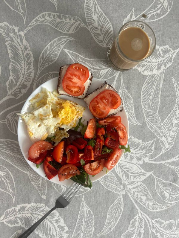 Breakfast Plate With Eggs, Tomato Salad, Cream Cheese On Bread, And Coffee