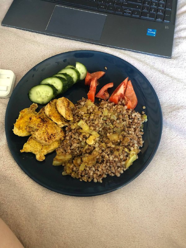 Homemade Meal With Seasoned Chicken, Buckwheat, Tomatoes, And Cucumbers