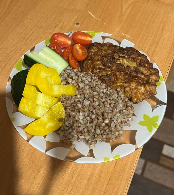 Breaded And Fried Chicken Cutlet With Buckwheat And Fresh Vegetables
