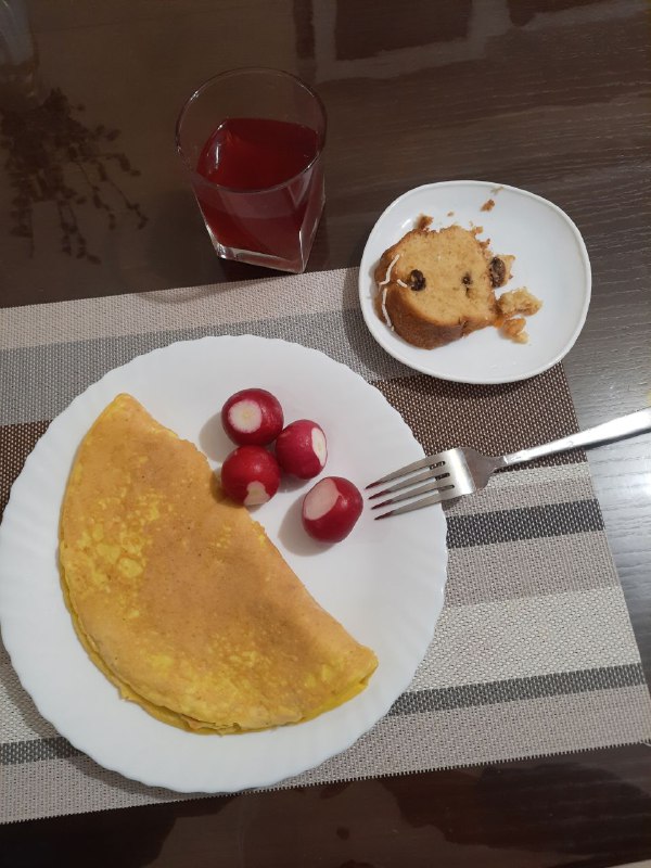 Omelette With Radishes And A Side Of Muffin And Juice