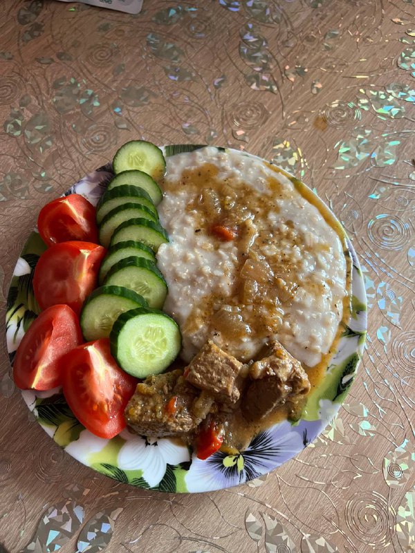 Oatmeal With Meat Stew And Fresh Vegetables