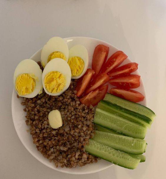 Healthy Meal With Boiled Eggs, Buckwheat, Tomatoes, Cucumber, And Almond