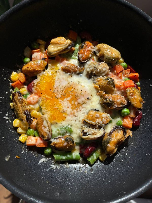 Seafood And Vegetable Stir-fry With Fried Egg