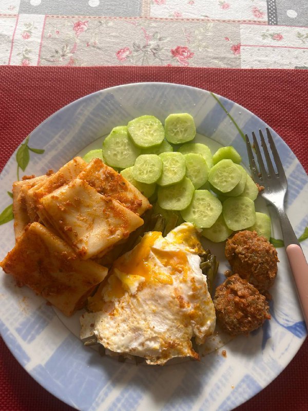 Lasagna With Fried Egg, Meatballs, And Cucumber Slices