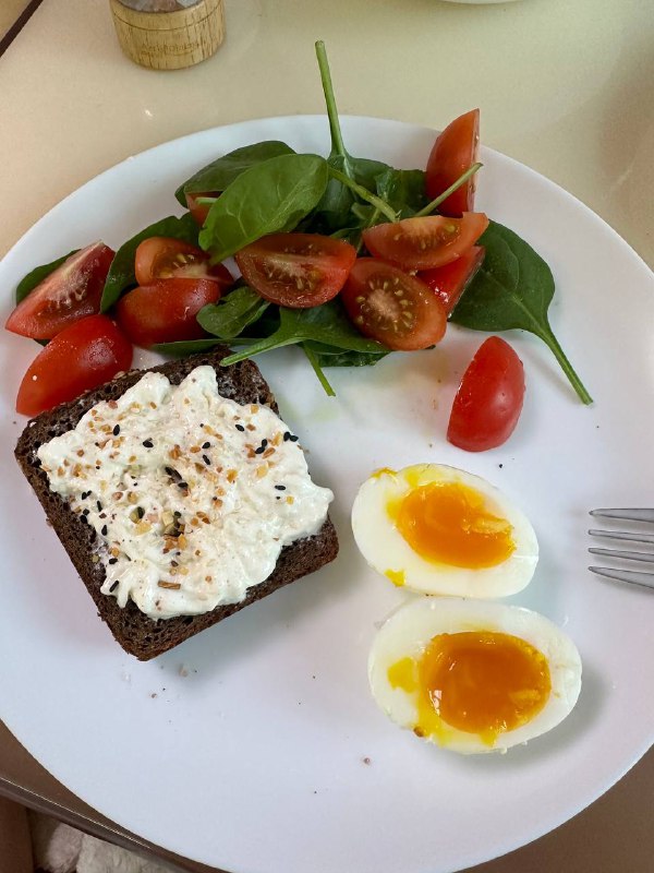 Whole Grain Bread With Ricotta, Soft Boiled Eggs, And Spinach Tomato Salad