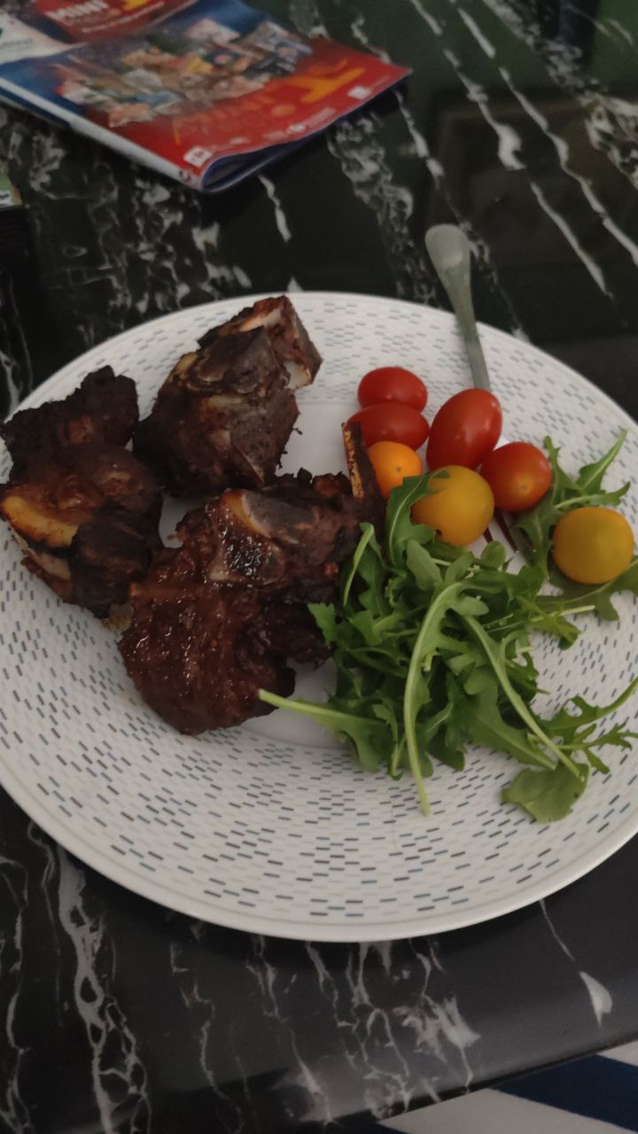 Grilled Beef Ribs With Cherry Tomatoes And Arugula