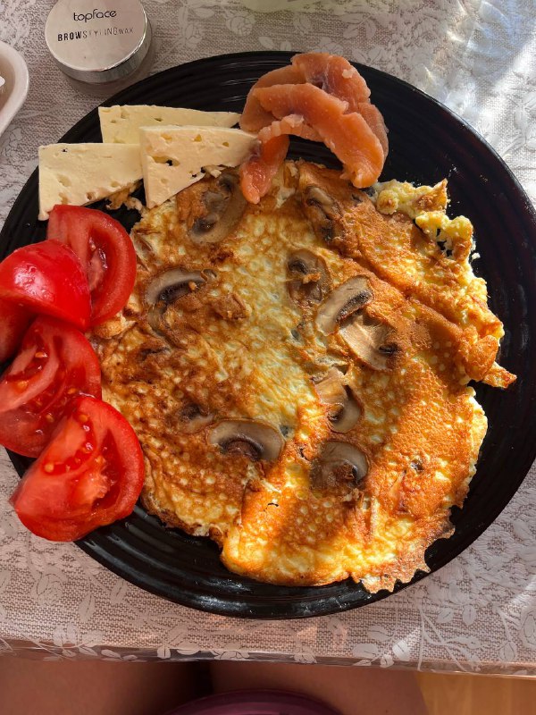 Mushroom Omelette With Tomatoes, Cheese, And Smoked Salmon