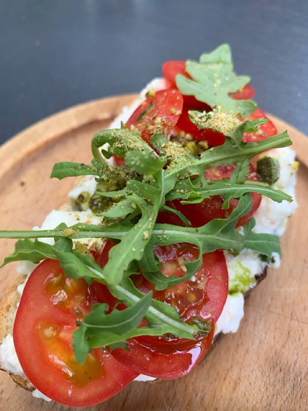Avocado Toast With Cottage Cheese, Tomatoes, And Arugula