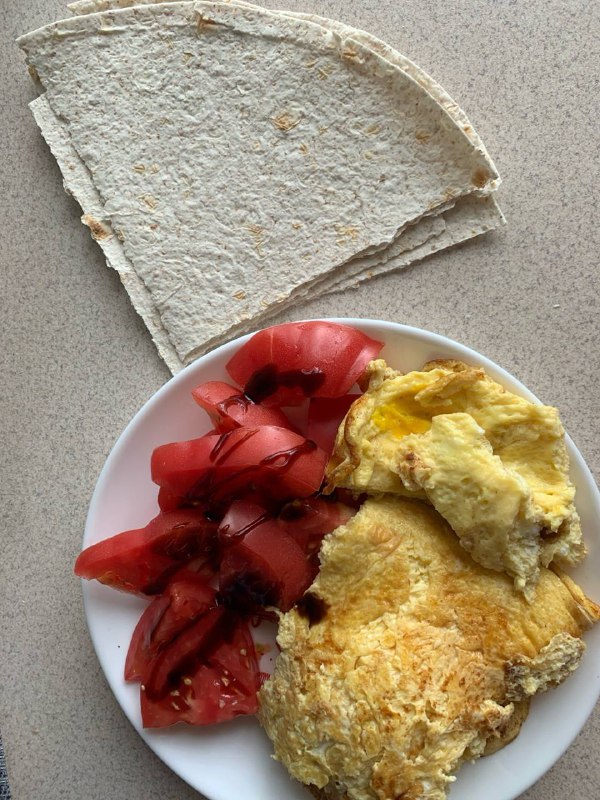 Omelette With Sliced Tomatoes And Flatbread