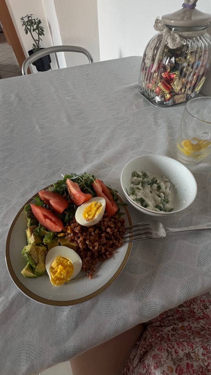 Boiled Egg, Buckwheat, Avocado Salad, And A Side Of Yogurt With Green Onions