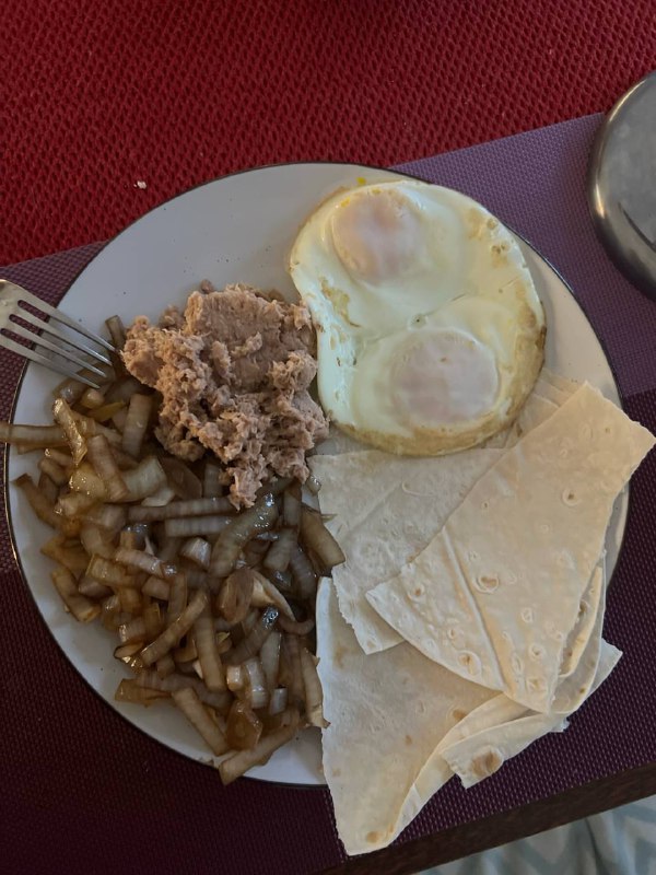 Eggs With Refried Beans, Onions, And Tortillas