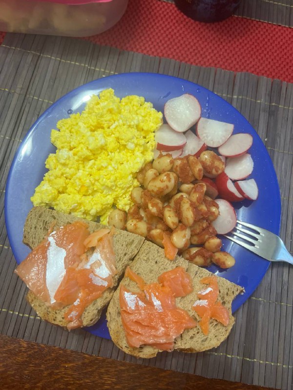 Breakfast Plate With Scrambled Eggs, Radishes, Beans, And Smoked Salmon Toast