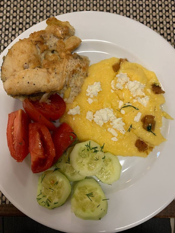 Fried Fish With Banosh Porridge, Tomato, And Cucumber